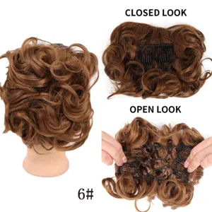 Synthetic hair bun extension with comb clip, heat resistant wavy updo hair piece detail view.