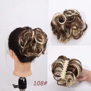 Synthetic claw clip hair bun extension, fluffy brown blonde curly updo wig piece.