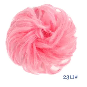 Detailed close-up view showing the soft texture and fluffy design of the pink synthetic hair bun.