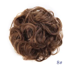 Synthetic curly hair bun scrunchie detail view, fluffy messy updo hair piece in brown shade.