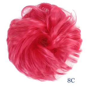 Synthetic hair bun scrunchie detail view, fluffy messy fake hair piece in bright pink color.