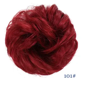 Synthetic hair bun scrunchie detail view, showing the fluffy messy red synthetic hair texture.