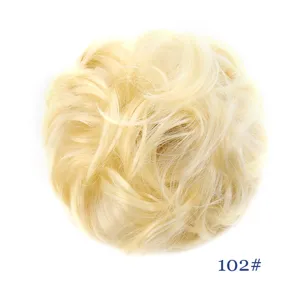Detailed shot of the fluffy messy synthetic hair bun scrunchie in light blonde color.