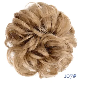 Synthetic blonde messy hair bun scrunchie detail view, natural fluffy hairpiece extension.