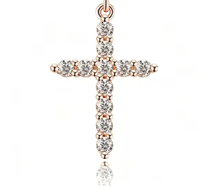 Macro view of rose gold cross pendant necklace featuring brilliant round cut clear stones.