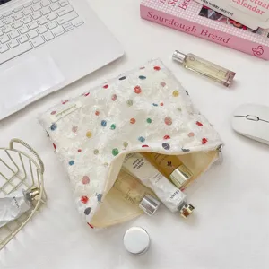 Sweet fluffy organza polka dot cosmetic bag detail shot showing spacious interior and cute design.