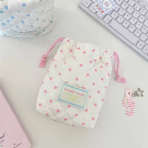Cute quilted polka dot drawstring pouch detail, soft fabric makeup and jewelry storage bag.