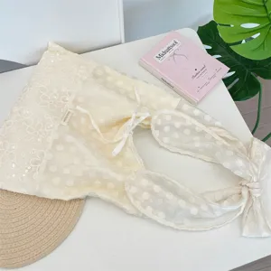 Detail view of sweet polka dot organza shoulder bag with lace embroidery and cute bow.