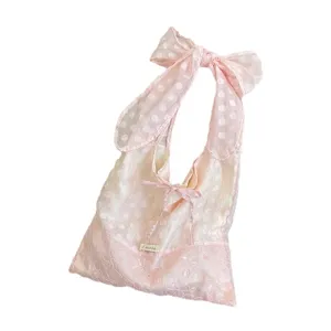 Pink polka dot organza tote bag with big bow and floral embroidery for cute daily style.