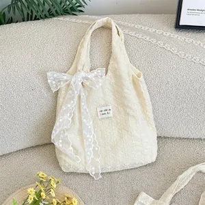 Cream embroidered lace tote bag with bow ribbon, fresh aesthetic single shoulder bag.