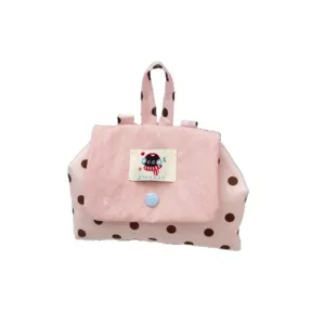 Pink polka dot cosmetic bag with top handle and cute flap closure, portable makeup pouch.