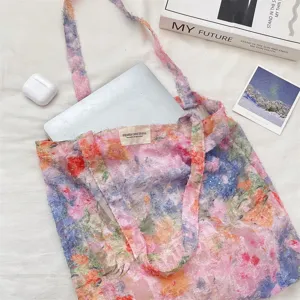 Detailed shot of the floral textured tote bag showcasing the artistic oil painting pattern and fabric.