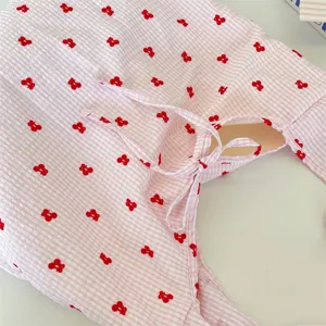 Pink checkered shoulder bag detail, cute red cherry print and sweet bow tie strap design.