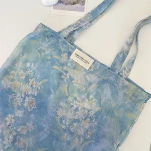 Blue floral canvas tote bag, oil painting style shoulder bag with 3D flocking flowers for everyday use.