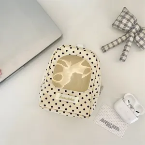 Polka dot doll storage bag with transparent window, cute mini backpack for figures.