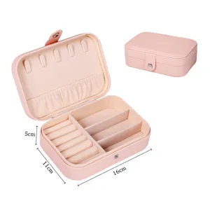 Portable pink double layer jewelry box with ring rolls and compartment for safe travel storage.