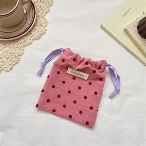 Pink velvet polka dot drawstring pouch, portable travel jewelry and cosmetic storage bag for women.