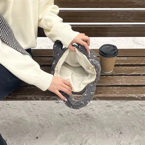 Close-up detail of the cozy winter plush handbag interior, showing soft fuzzy texture and lining.