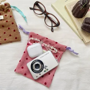 Detail shot of portable velvet polka dot drawstring pouch for travel jewelry and cosmetics.