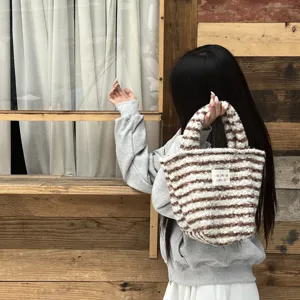 Cute winter plush handbag with brown stripes, soft fuzzy tote bag for daily fashion wear.