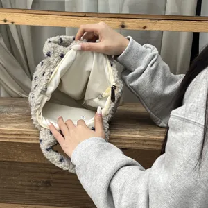 Cute winter plush handbag with soft fluffy texture, cozy style and spacious inner lining.