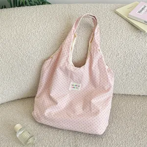 Pink polka dot canvas tote bag, casual lazy style shoulder bag for daily travel and shopping.