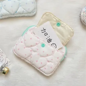 Portable quilted card holder pouch with snap button and cute heart star pattern detail view.