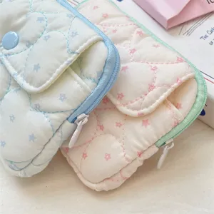 Portable quilted card holder with snap closure and multi-layers for daily essentials.