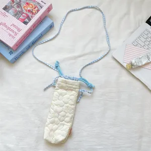 Quilted camera pouch with blue check strap, cute floral stitching crossbody bag detail view.