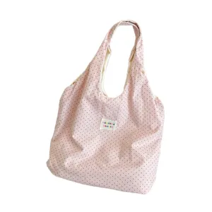 Pink polka dot canvas tote bag, casual shoulder bag for women and students, lightweight design.