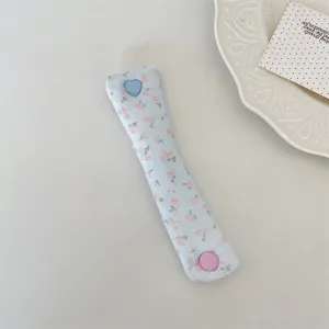 Floral data cable organizer strap with heart button, cute fabric earphone cord storage wrap.
