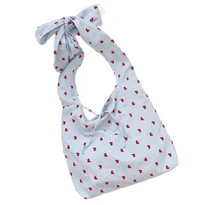 Blue gingham shoulder bag with red cherry print and cute bow strap for daily casual wear.