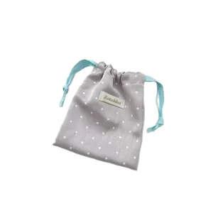 Korean style polka dot storage bag, smooth satin texture, cute drawstring pouch for travel.