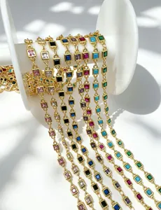 Close-up detail of colorful square zircon gold plated DIY jewelry semi finished chain roll.