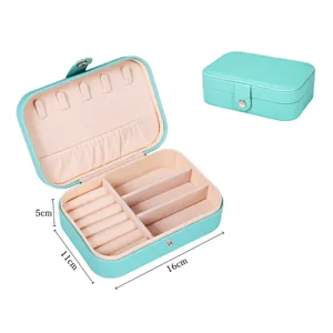 Portable double layer PU leather travel jewelry box organizer with ring rolls and mirror.