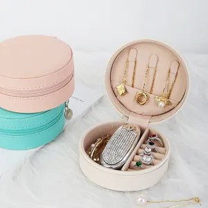 Caja de almacenamiento de joyas redonda portátil de cuero PU para anillos y aretes
