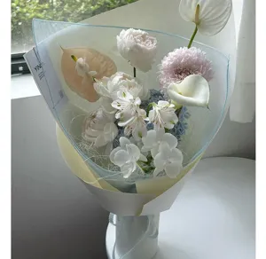 Korean style translucent square gauze flower wrapping net for bouquet packaging and floral design detail.