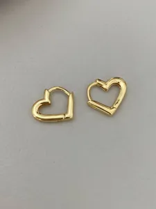 Elegant gold-plated heart huggie earrings for women, minimalist daily chic jewelry.