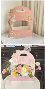 Pink handheld flower gift box with elegant butterfly and floral illustrations for DIY floral art.