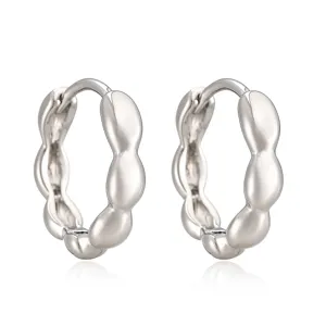 Elegant silver-toned wavy geometric hoop earrings with high-shine reflective mirror finish
