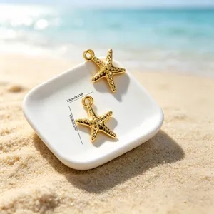 Detailed view of gold starfish charms for jewelry making showing 1.7cm x 1.3cm dimensions