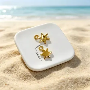 Detailed view of gold starfish pendant dimensions 1cm by 1.3cm for ocean jewelry