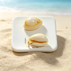 Detailed view of two ocean style shell pendants with dimensions shown in cm and inches