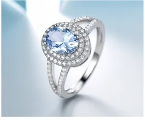 Attraktiver 925 Silber Luxus Ring mit hellem blauen Ovalstein und doppeltem Zirkon Halo neu.