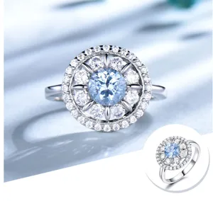 Exquisiter Silber-Halo-Ring mit strahlendem blauen Stein und funkelnden klaren Zirkoniasteinen.