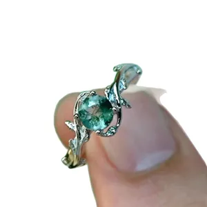 Stunning moss agate ring featuring silver vine leaf design, elegant gemstone jewelry for women.
