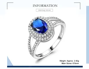 Silberring mit ovalem blauen Zirkon und doppelter Glitzerstein Einfassung fur Damen.