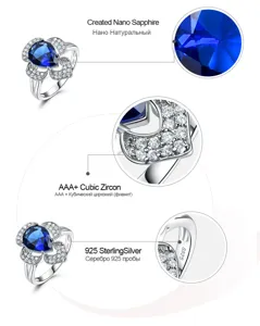 Stunning 925 sterling silver flower ring featuring created nano sapphire and cubic zirconia.