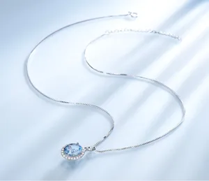 Elegante S925 Silber ovale hellblaue Edelstein Halo Anhänger Halskette für Damenschmuck