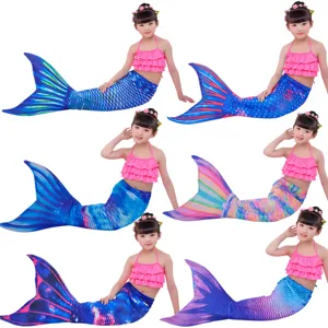 Kids mermaid swimsuit set detail showing multi-color variant tails and pink bikini top.